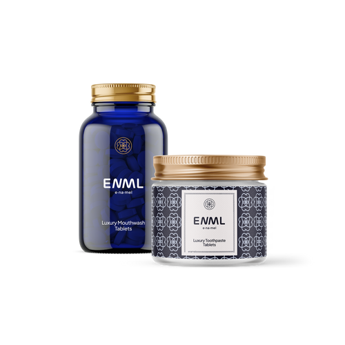A set of ENML oral care products featuring a jar of Luxury Toothpaste Tablets and a blue bottle of Luxury Mouthwash Tablets, showcasing sleek, eco-friendly packaging for micro hydroxyapatite based oral care