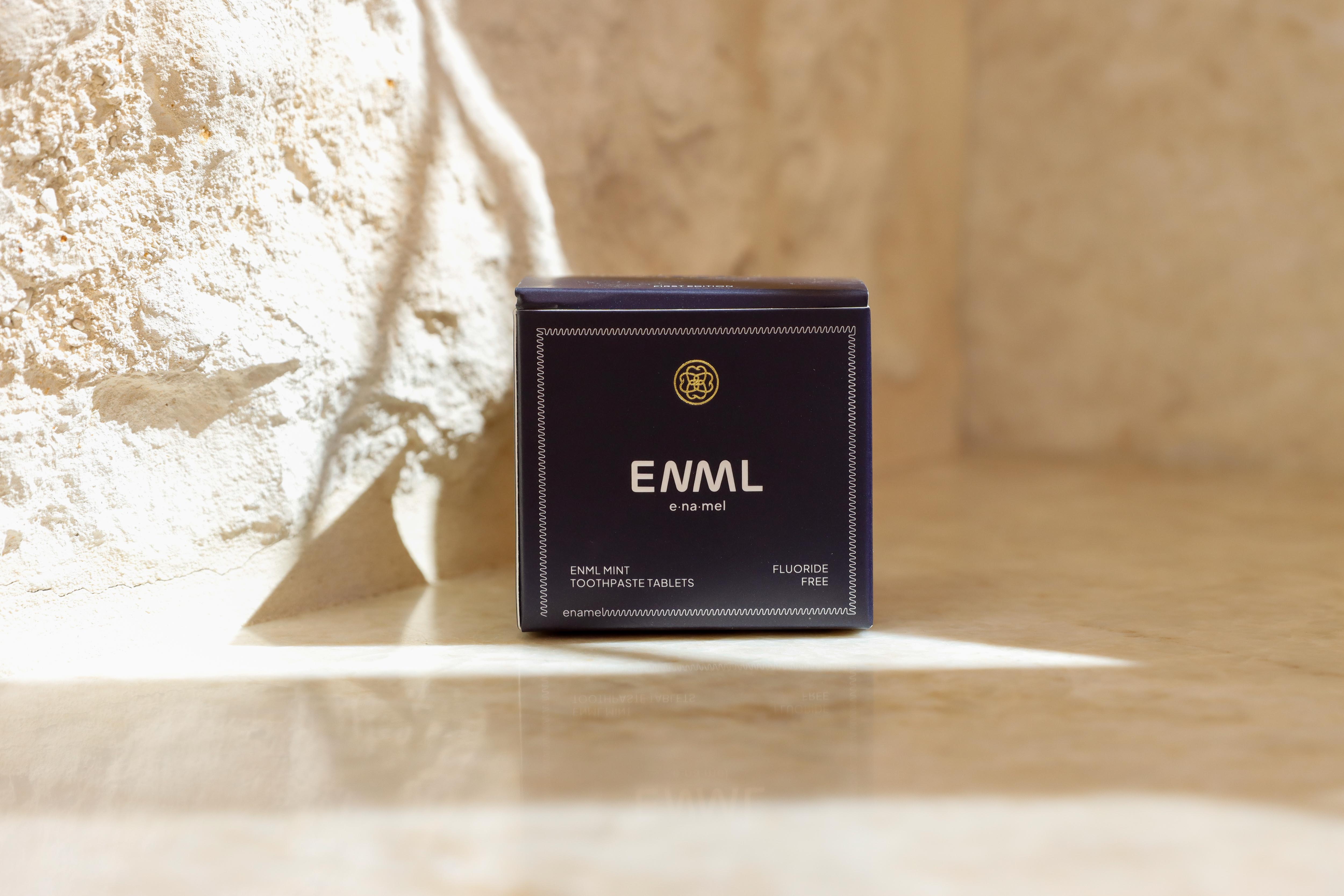 ENML Cinnamon Toothpaste Tablets packaging front view on marble - premium cinnamon flavor oral care