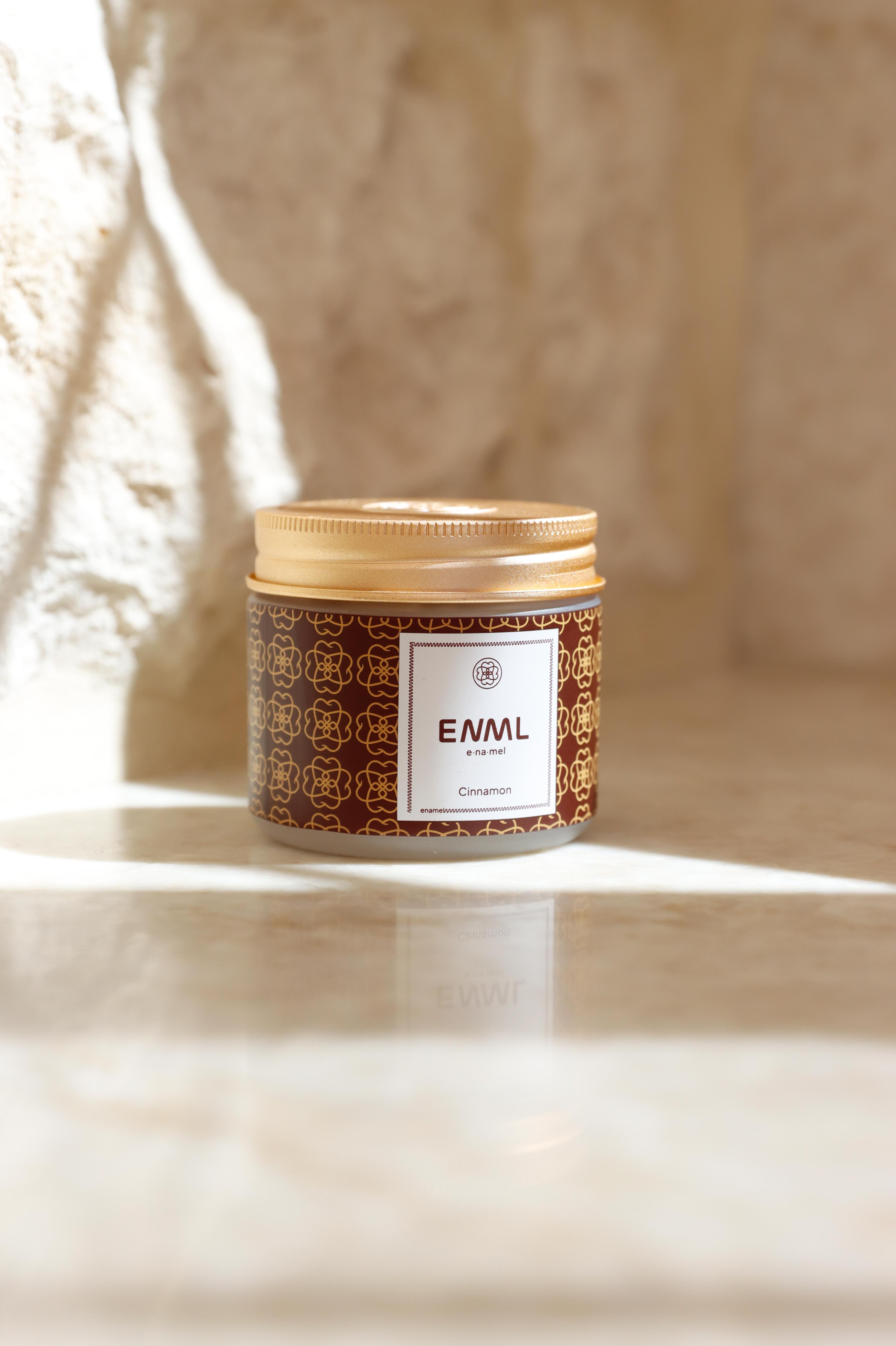 ENML Cinnamon Toothpaste Tablets jar with box on marble - warm spicy cinnamon fluoride-free oral care