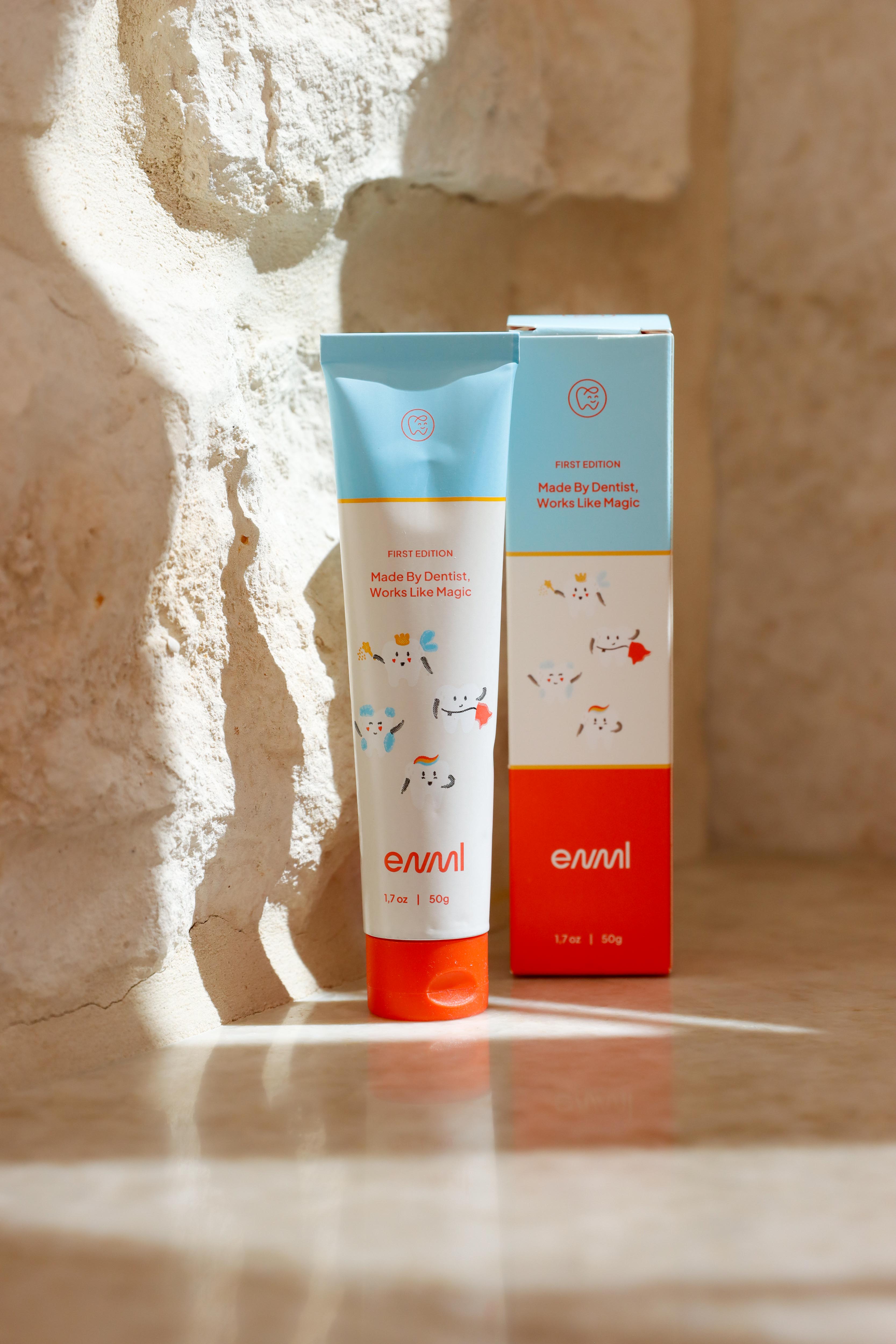 ENML Kids Strawberry Toothpaste tubes on marble - fluoride-free children's toothpaste for ages 2 and up