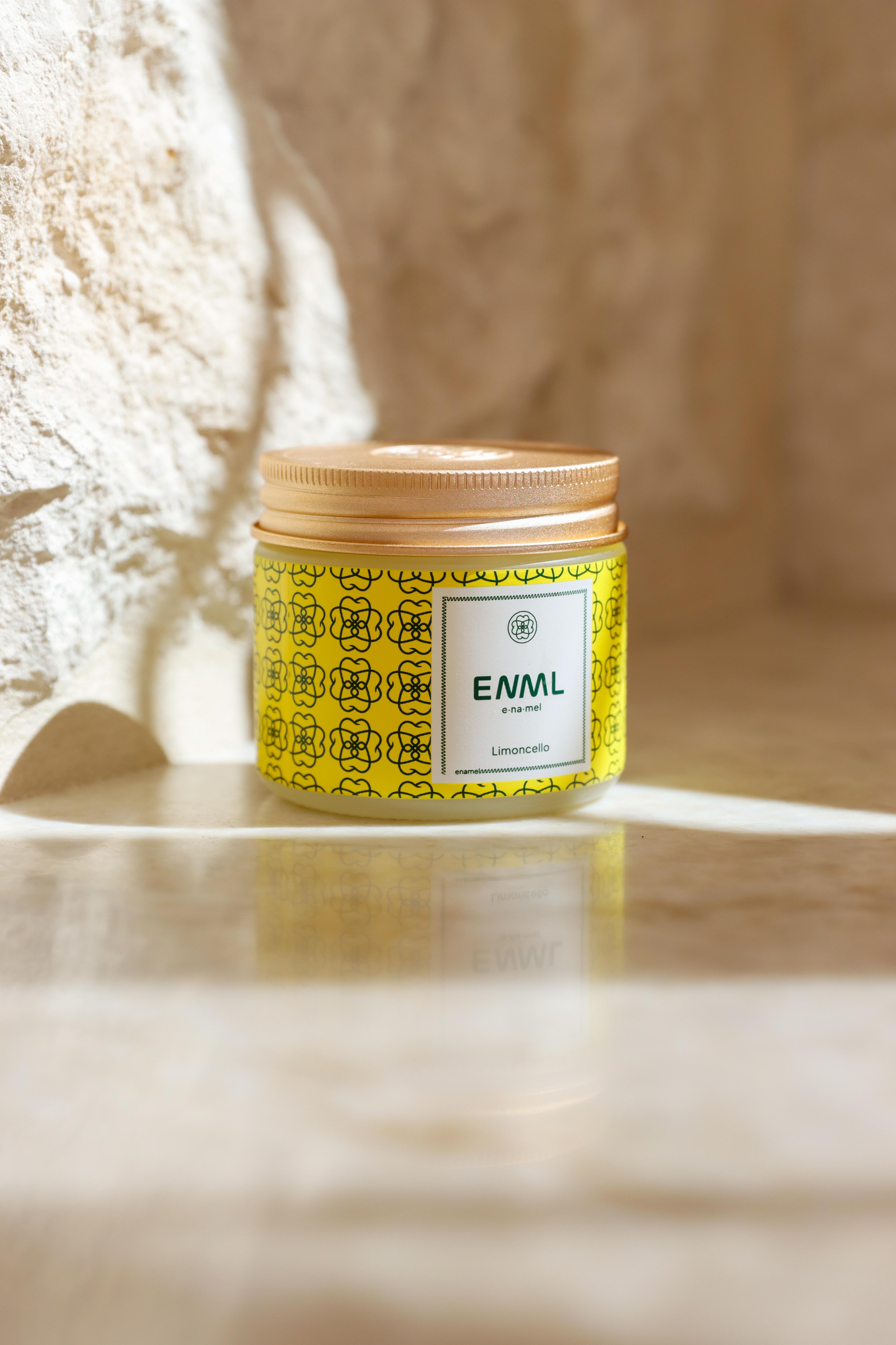 ENML Limoncello Toothpaste Tablets jar and retail box on marble - bright citrus lemon fluoride-free oral care