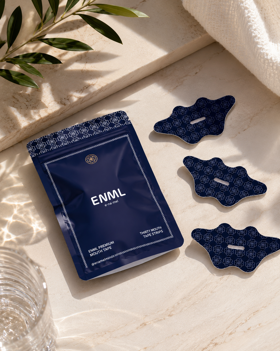 ENML Premium Collagen Mouth Tape pouch with mouth tape strips on marble surface - dentist-designed nasal breathing tape for sleep