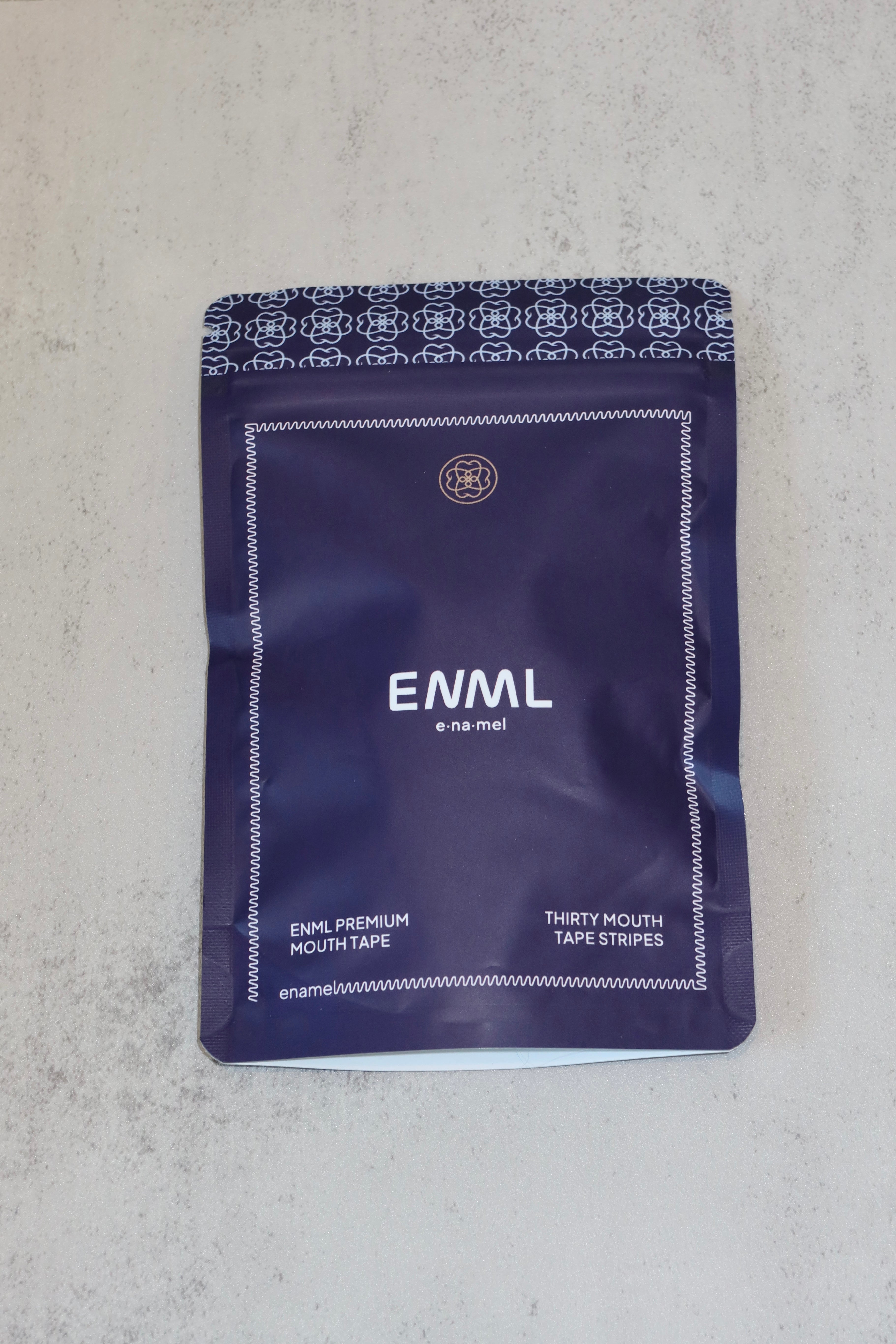 ENML Premium Collagen Mouth Tape packaging detail - dentist-designed with ENML signature pattern