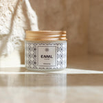 ENML Whitening Toothpaste Tablets jar on marble surface - fluoride-free hydroxyapatite whitening tablets with gold lid